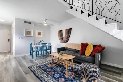 a living room with a couch and a table at Mia Airport 1b Apt with desk Virg 9 in Miami