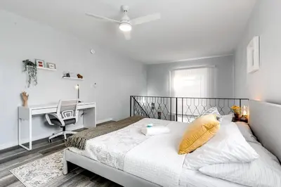 a bedroom with a bed with a desk and a chair at Mia Airport 1b Apt with desk Virg 9 in Miami