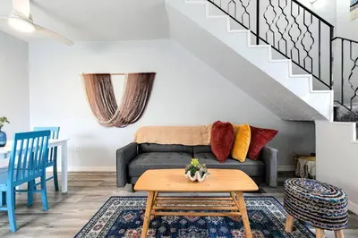 a living room with a couch and a table at Mia Airport 1b Apt with desk Virg 9 in Miami