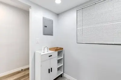 a white bathroom with a sink and a window at Central 1b apt Next to Airport Virg 12 in Miami