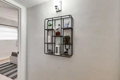 a wall with a shelf on a wall at Roomy 2 BR near Miami Airport Virg 7 in Miami