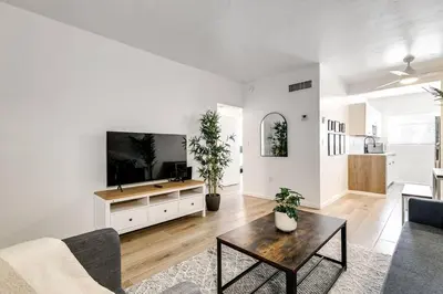 a living room with a tv and a table at Miami Airport 2-bedroom unit with speedy Wi-Fi Virg8 in Miami