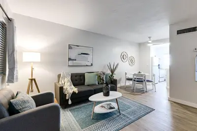 a living room with a couch and a table at Mia Springs 2BR wi-fi Virg 3 in Miami