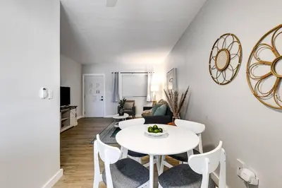 a living room with a white table and chairs at Mia Springs 2BR wi-fi Virg 3 in Miami