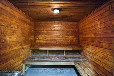 an empty wooden sauna with a bench in it at Star Dust! Heart of Miami Dream Stay! 4 BR in Miami