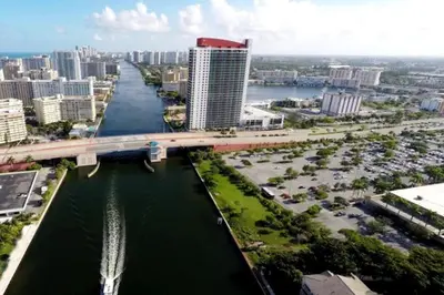an aerial view of a city with a bridge over a river at Beach Retreat, Sleek Design & Full Kitchen -A in Hallandale Beach