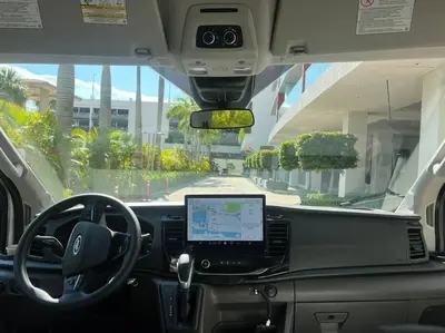 a view of the inside of a car with a laptop computer at High-End Miami Condo, Ocean Views & Kitchen -A in Hallandale Beach