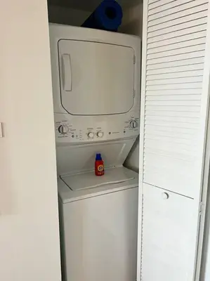 a small white microwave in a white refrigerator at Seaside Style in Miami, Modern Comfort & Full Kitchen -A in Hallandale Beach