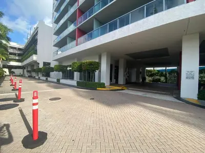 a building with red and white cones in front of it at elax & Recharge in This Incredible Miami Studio in Hallandale Beach
