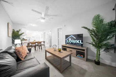a living room with a couch and a table at Holiday Park Apartments by Lowkl in Fort Lauderdale