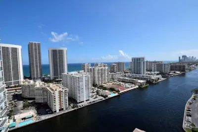 an aerial view of a city with a river and buildings at Modern Miami Studio with 2 full beds, Cozy & Convenient in Hallandale Beach