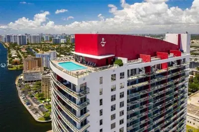 an aerial view of a building with a swimming pool at Oceanfront Studio with Beach, Pool & Restaurants in Hallandale Beach