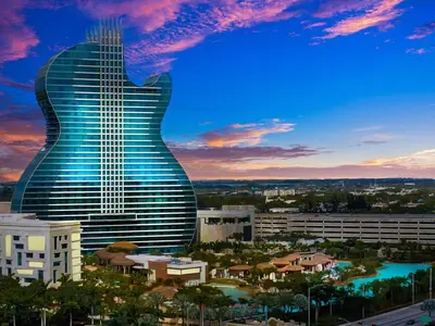 a guitar shaped building with a city in the background at Lakeside Retreat with Private Yard & Kayak in Fort Lauderdale