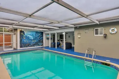 a swimming pool with a ceiling with a swimming pool at Vacation Villa W Heated Pool Beach & Casino in Hollywood