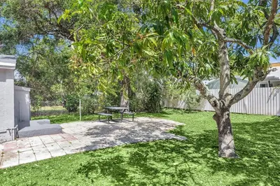 a park with a picnic table and a tree at Boutique Vacation Studio - Beach, Mall, Casino Hn2 in Hallandale Beach