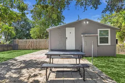 a picnic table in front of a tiny house at Boutique Vacation Studio - Beach, Mall, Casino Hn2 in Hallandale Beach