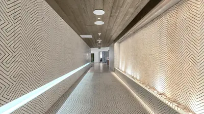 a hallway with a white wall with a pattern on it at Your Private Oceanfront Sanctuary 2BR 2BA in Fort Lauderdale