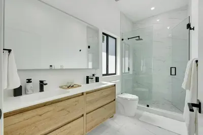 a bathroom with a shower and a sink and a toilet at Radiance - Modern Design, Poolside Escape in Miami