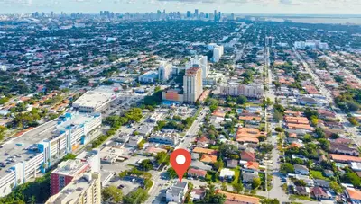 an aerial view of a city with a red arrow at Deco Delight - Central Hub in Miami