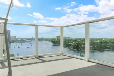 a view of a river from a balcony at Tiffany Ebony - Ocean & Canal views, Walk to Beach in Fort Lauderdale