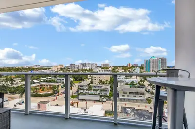a balcony with a view of the city at Tiffany Indigo - Rooftop Pool, Gym, Walk to Beach in Fort Lauderdale