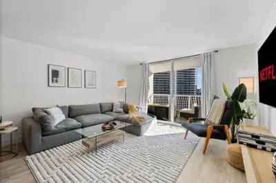 a living room with a couch and a table at Luxury Brickell Waterfront View - Amazing Furnished Balcony - Walk-Water-WiFi in Miami