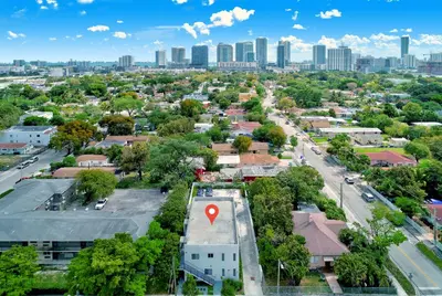 an aerial view of a city with a red arrow on a building at ArTease3 - stylish, near Wynwood Walls & restaurants in Miami