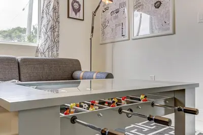 a living room with a table and a couch at ArTease3 - stylish, near Wynwood Walls & restaurants in Miami