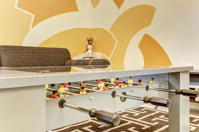 a room with a bed and a table with toy figurines at ArTease4 - stylish, near Wynwood Walls & restaurants in Miami