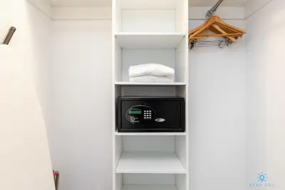 a bathroom with a white closet with a microwave at Upper studio with Balcony - Pool - Gym in Hallandale Beach