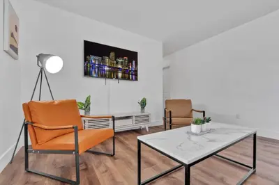 a living room with a table and two chairs at Escape to Private Poolside Bliss in Hollywood