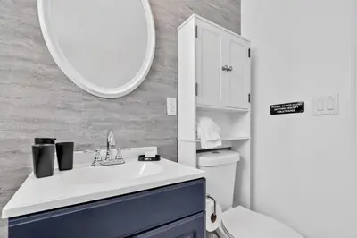 a bathroom with a sink and a mirror at Escape to Private Poolside Bliss in Hollywood
