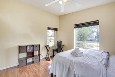 a bedroom with a bed and a desk and a window at 4 Mi to Beach Hollywood Home with Patios! in Hollywood