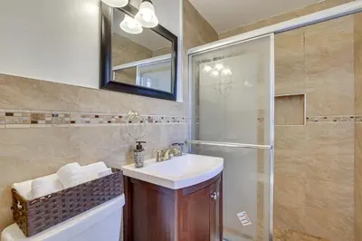 a bathroom with a sink and a shower at 4 Mi to Beach Hollywood Home with Patios! in Hollywood
