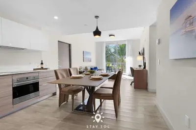 a kitchen and dining room with a table and chairs at Hot Tub - Hollywood Beach Boardwalk - Amazing Pool in Hollywood