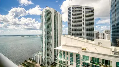 a view of some tall buildings and the water at Beautiful Brickell Miami apt 2BR/2BA + Parking in Miami