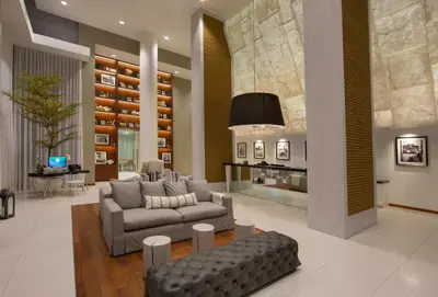 a living room with a couch and a table at Ocean 2 Sky at Monte Carlo Miami Beach in Miami Beach
