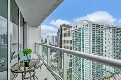 a balcony with a table and a view of a city at Perfect One Bedroom at Icon Brickell Amazing views in Miami