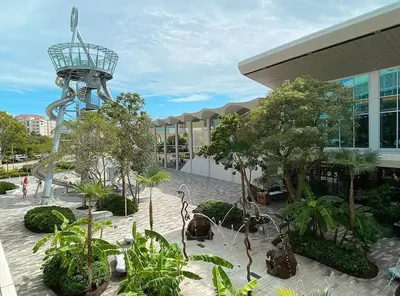 a building with a tower in the middle of a courtyard at Smart Tiny House Garden in Miami Gardens