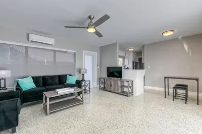 a living room with a couch and a tv at Sunshine Manors 2025-A in Fort Lauderdale