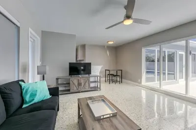 a living room with a couch and a table at Sunshine Manors 2025-A in Fort Lauderdale