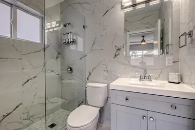 a bathroom with a toilet and a sink and a shower at Sunshine Manors 2009 A in Fort Lauderdale