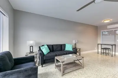 a living room with a couch and a table at Sunshine Manor 2025-C in Fort Lauderdale