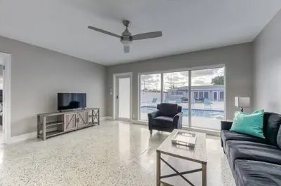 a living room with a couch and a tv at Sunshine Manor 2025-C in Fort Lauderdale