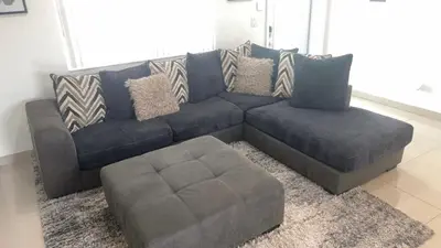 a blue couch and a ottoman in a living room at BOOK ME, 3mins Hard Rock Stadium in Miami Gardens