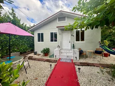 a house with a red path in front of it at Beach vibes 2 bedrooms house in Miami