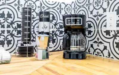 two blenders sitting on a counter with a blender at Serenity Lodge Condo in Miami