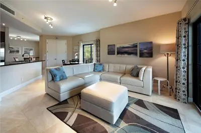 a living room with a couch and a table at 2/2 Boutique Condo in Ft. Lauderdale in Fort Lauderdale