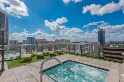a rooftop hot tub on the roof of a building at 18th Floor Ocean Views Pool Beach Fitness in Hallandale Beach