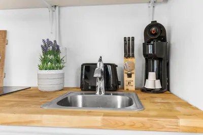 a kitchen counter with a sink in a kitchen at Sun Getaway Rentals in Fort Lauderdale